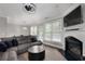 Cozy living room featuring a fireplace, large windows, and comfortable seating at 4023 Caitlyn Pl, Atlanta, GA 30360