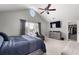 Comfortable bedroom featuring a ceiling fan, large windows, and stylish furnishings at 4023 Caitlyn Pl, Atlanta, GA 30360