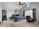 Spacious bedroom with vaulted ceilings, fan, and a large window providing natural light at 4023 Caitlyn Pl, Atlanta, GA 30360