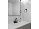 Stylish powder room with a modern sink, black faucet, and elegant mirror at 4023 Caitlyn Pl, Atlanta, GA 30360