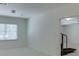 Minimalist basement with neutral carpet, a treadmill, and a window to the outside at 4530 Bogan Gates Dr, Buford, GA 30519