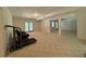 Spacious basement with plush carpet, walk-out doors, and versatile layout for various uses at 4530 Bogan Gates Dr, Buford, GA 30519