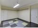 Basement with hanging light and vinyl tile flooring at 4530 Bogan Gates Dr, Buford, GA 30519