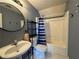 Full bathroom with shower, vanity and updated fixtures at 4530 Bogan Gates Dr, Buford, GA 30519