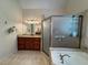 Bathroom with shower, tub, vanity and updated fixtures at 4530 Bogan Gates Dr, Buford, GA 30519