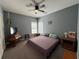 Bedroom with ceiling fan, double window, and natural light at 4530 Bogan Gates Dr, Buford, GA 30519