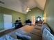 Spacious living room featuring vaulted ceiling, neutral paint, ceiling fan, and a comfortable couch at 4530 Bogan Gates Dr, Buford, GA 30519