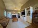 Cozy living room features built-in shelving, a fireplace, and plush carpet, creating a welcoming atmosphere at 4530 Bogan Gates Dr, Buford, GA 30519