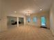 Large living room with recessed lighting, light carpet, and multiple openings to adjoining rooms at 4530 Bogan Gates Dr, Buford, GA 30519