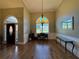 Elegant living room features hardwood floors, arched windows, and refined detailing, perfect for entertaining guests at 4530 Bogan Gates Dr, Buford, GA 30519