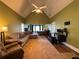 Open living room features vaulted ceilings, modern lighting, comfortable seating and views to bedroom at 4530 Bogan Gates Dr, Buford, GA 30519
