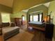 Bright main bedroom with sitting area, dresser, and lots of natural light at 4530 Bogan Gates Dr, Buford, GA 30519