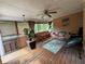 Relaxing screened-in porch features a hammock, wicker furniture, and natural wood flooring at 4530 Bogan Gates Dr, Buford, GA 30519
