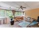 Relaxing screened porch featuring a hammock, ceiling fan and wood floors at 4530 Bogan Gates Dr, Buford, GA 30519