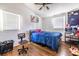 Bedroom with hardwood floors, ceiling fan, natural light, a workstation, and black out shades at 110 Turman Se Ave, Atlanta, GA 30315
