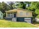 Charming single-Gathering home featuring a covered porch, driveway, and attached single car garage at 110 Turman Se Ave, Atlanta, GA 30315