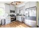 Modern kitchen with stainless steel appliances, lots of counter space, and gray cabinets at 110 Turman Se Ave, Atlanta, GA 30315