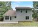 The house features a concrete patio, siding, double-hung windows, and a glass door that leads into the sunroom at 169 Parkside Dr, Stockbridge, GA 30281