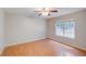 Comfortable bedroom featuring hardwood floors and ample natural light from window at 169 Parkside Dr, Stockbridge, GA 30281