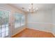 Cozy dining area with backyard access and an elegant chandelier fixture at 169 Parkside Dr, Stockbridge, GA 30281