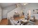 Bright and airy living room with vaulted ceilings, wood floors, and modern furnishings at 169 Parkside Dr, Stockbridge, GA 30281