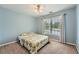 The blue bedroom features a large window with a ceiling fan, with light streaming through at 3363 Linton Ln, Marietta, GA 30066