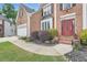 Charming two-story brick home featuring an attached garage, landscaped front yard, and a welcoming red front door at 3363 Linton Ln, Marietta, GA 30066