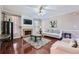 Bright and airy living room featuring a brick fireplace and hardwood flooring at 3363 Linton Ln, Marietta, GA 30066