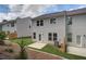 Backyard view of the home, showcasing the lawn and outdoor space at 360 Navigator Ln, Mcdonough, GA 30253