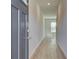 Inviting entryway with light gray walls and wood-look floors, leading to a bright living space at 360 Navigator Ln, Mcdonough, GA 30253