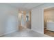 Hallway with neutral walls leads to laundry area at 360 Navigator Ln, Mcdonough, GA 30253