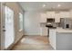 This contemporary kitchen features modern appliances and white cabinetry at 360 Navigator Ln, Mcdonough, GA 30253