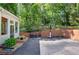 Backyard featuring a basketball court and a lush wooded backdrop at 3695 Highway 140, Rydal, GA 30171