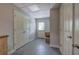 Basement with white doors, gray floors, and ample storage space for various household items at 3695 Highway 140, Rydal, GA 30171
