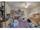 Basement storage features shelves stocked with goods, and boxes scattered on a vibrant rug at 3695 Highway 140, Rydal, GA 30171