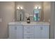 Bathroom boasts double vanity, framed mirrors, and ample counter space at 3695 Highway 140, Rydal, GA 30171