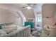 Cozy bedroom features a daybed, colorful rug, and a brightly colored dresser with charming decorations at 3695 Highway 140, Rydal, GA 30171