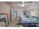Bright bedroom featuring a daybed with a decorative rug, and a doorway leading to another room at 3695 Highway 140, Rydal, GA 30171