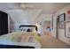 Bedroom with a quilted bed and colorful pillows, hardwood floors, and art on the wall at 3695 Highway 140, Rydal, GA 30171