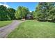 Beautiful home with brick facade, well-manicured lawn, and a private, winding driveway at 3695 Highway 140, Rydal, GA 30171