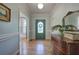Elegant foyer with hardwood floors, classic trim, and a decorative mirror at 3695 Highway 140, Rydal, GA 30171