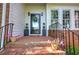 Charming front entrance with brick and black railing at 3695 Highway 140, Rydal, GA 30171