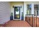 Classic front door with black railing and landscaping at 3695 Highway 140, Rydal, GA 30171