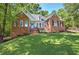 Lovely brick home featuring manicured lawn and inviting front porch at 3695 Highway 140, Rydal, GA 30171