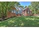 Beautiful brick home with lush green lawn and mature trees at 3695 Highway 140, Rydal, GA 30171