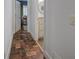 Hallway with patterned tile flooring leading to the bathroom and living room at 3695 Highway 140, Rydal, GA 30171