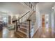 Hallway with hardwood flooring leading to a living room with fireplace at 3695 Highway 140, Rydal, GA 30171