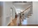 Spacious hallway with hardwood floors and staircase leading to upper level at 3695 Highway 140, Rydal, GA 30171