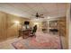 Spacious home office in basement features wood paneling and large rug at 3695 Highway 140, Rydal, GA 30171