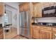 Kitchen featuring stainless steel refrigerator and wood cabinets at 3695 Highway 140, Rydal, GA 30171